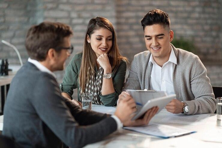 Young happy couple consulting with a private lender