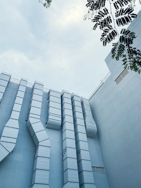 A low-angle image of HVAC ductwork on the outside of a building