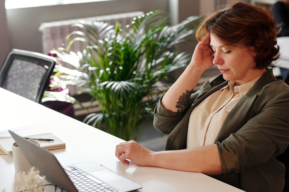 a woman at her work desk.