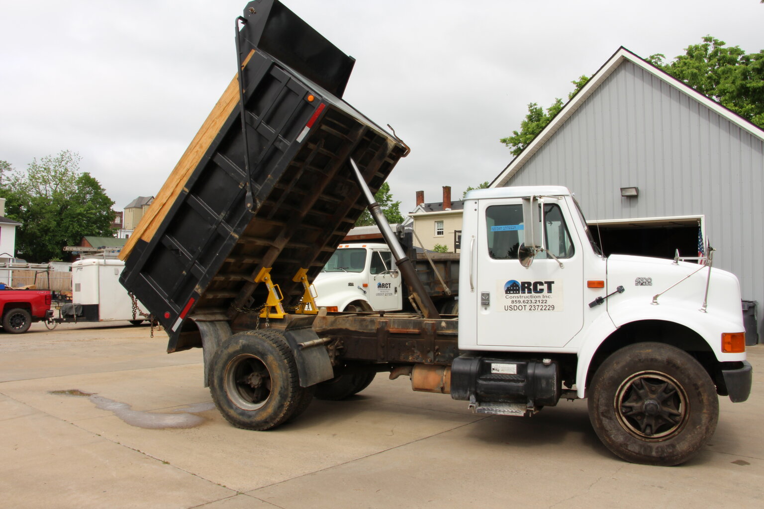 A BedLock system securely stabilizing a dump truck bed.