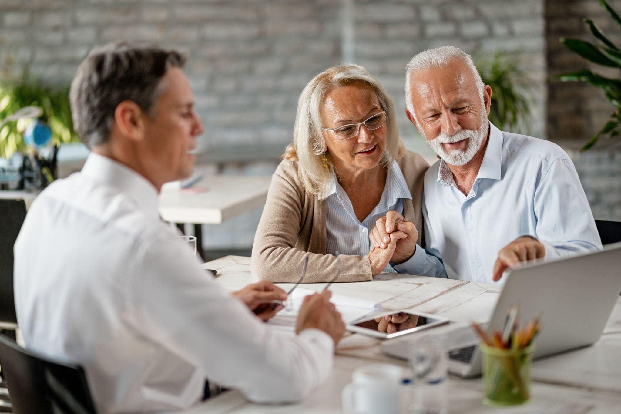 Elderly couple at an insurance office in Dallas