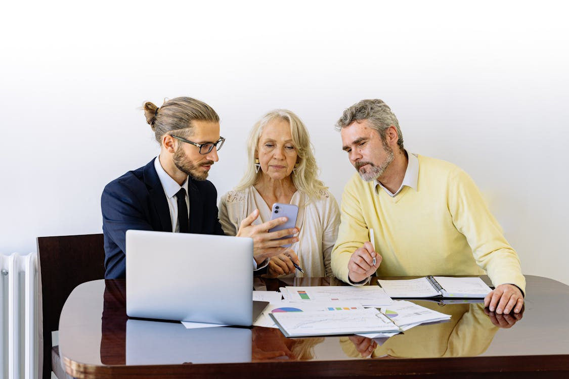 A couple applying for a construction development loan as the lender explains the terms