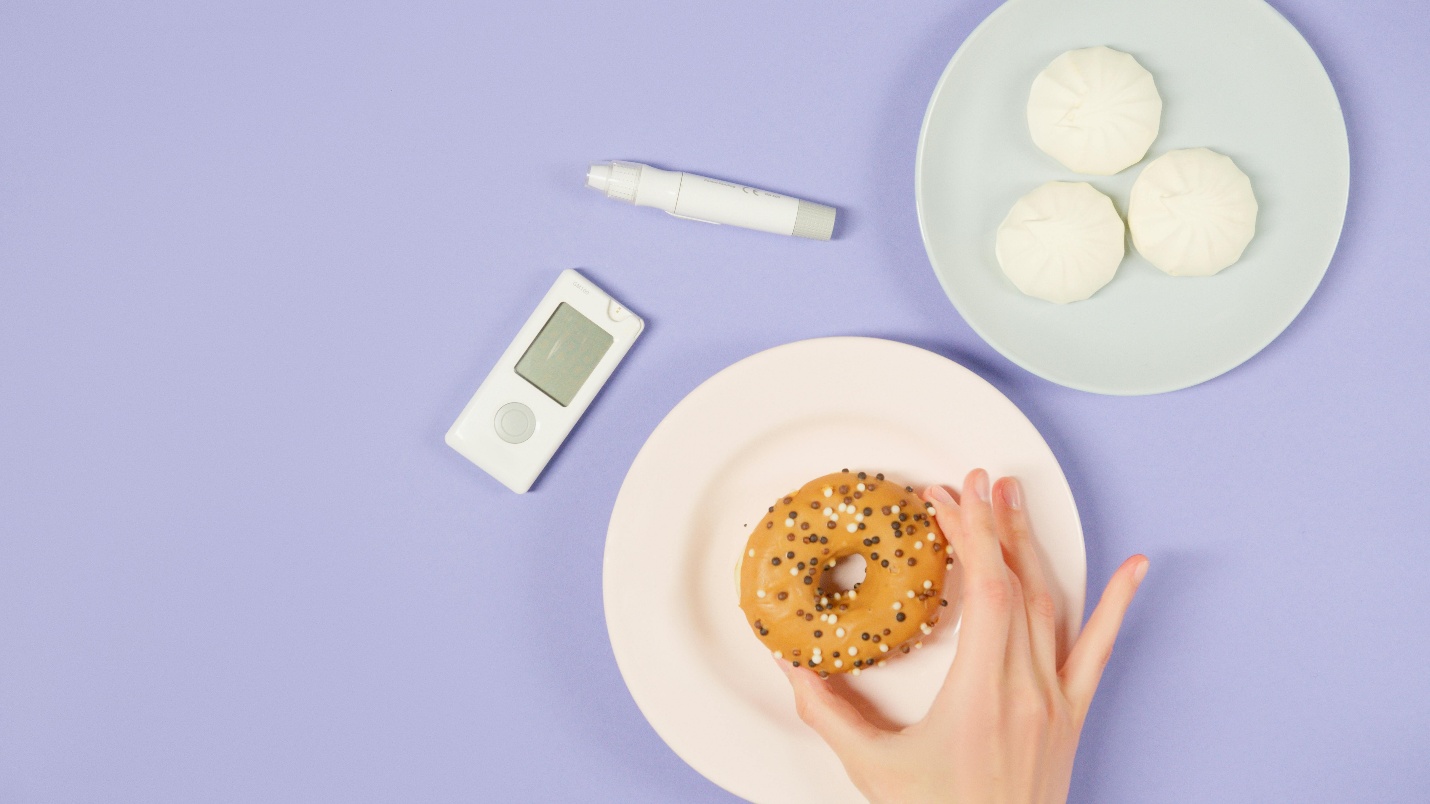 A picture of a person holding a donut