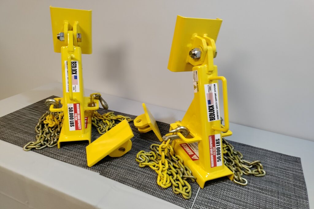 Two BedLock safety stands placed on a workbench before installation