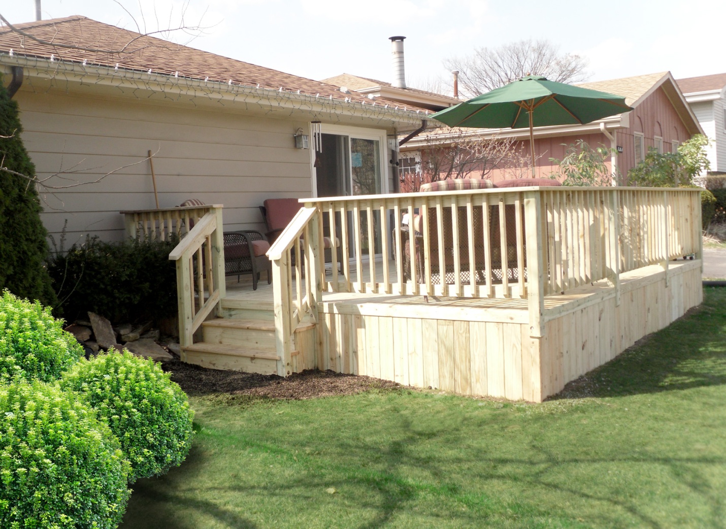 a beautiful patio with a wooden deck.