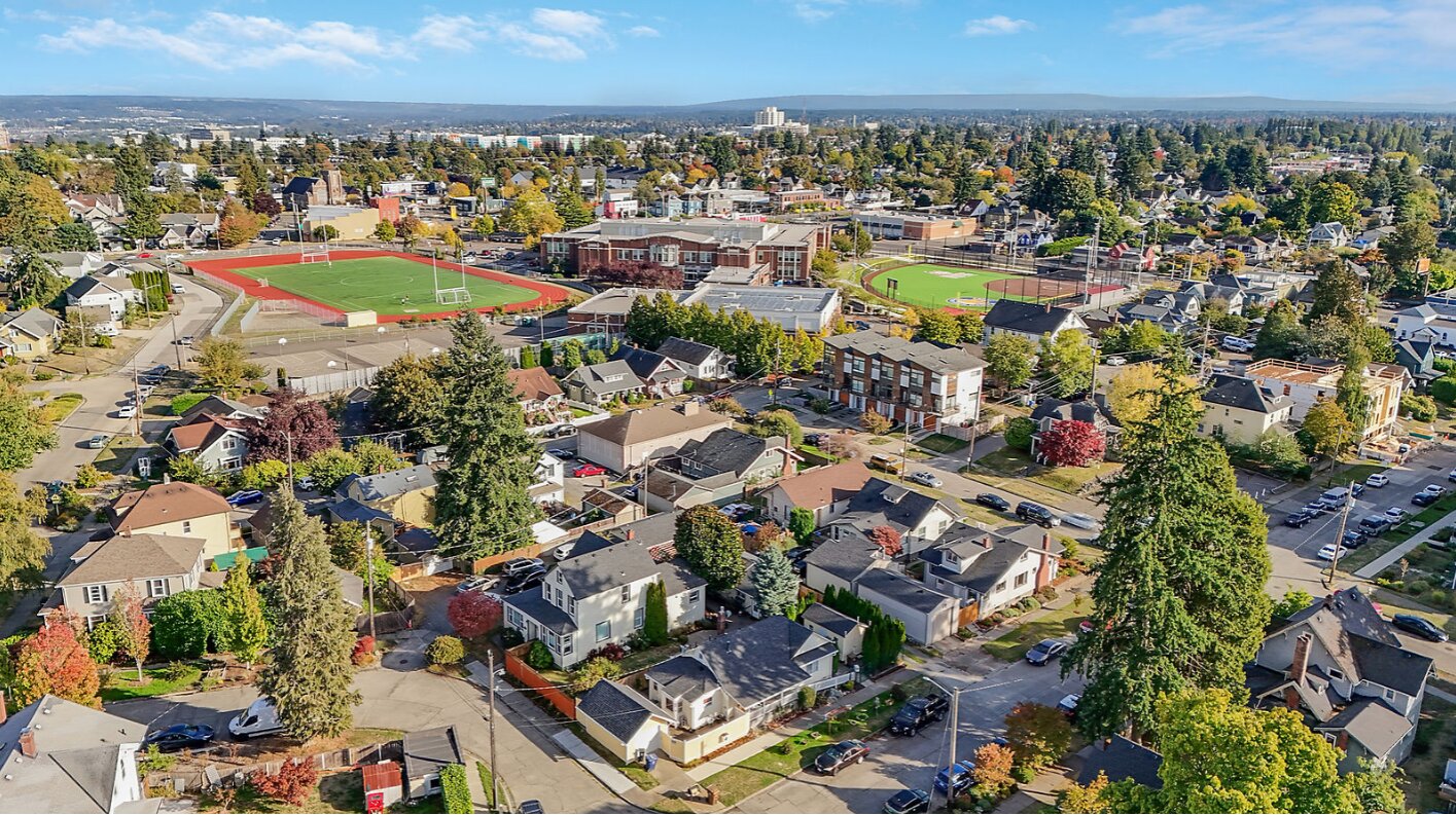 aerial view of residential neighborhood with houses and trees