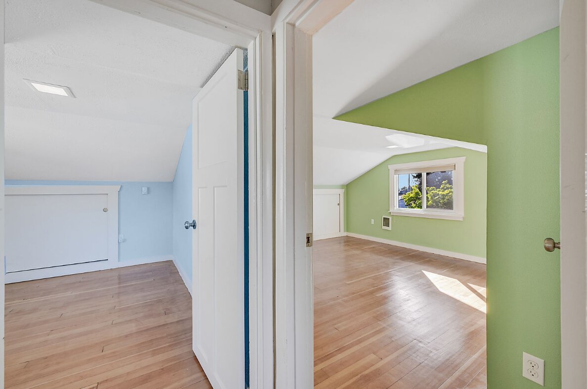 two connected interior rooms viewed through a doorway