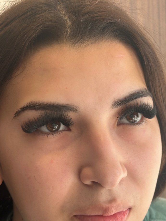 A woman wearing eyelash extensions