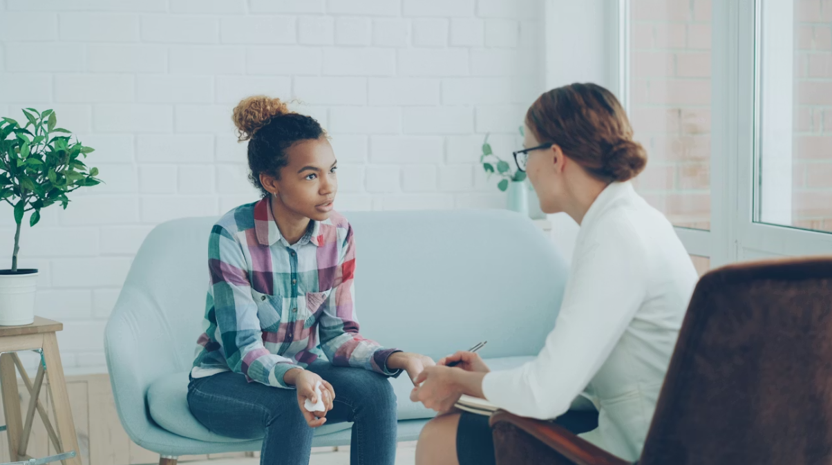 This image shows a woman talking to her therapist